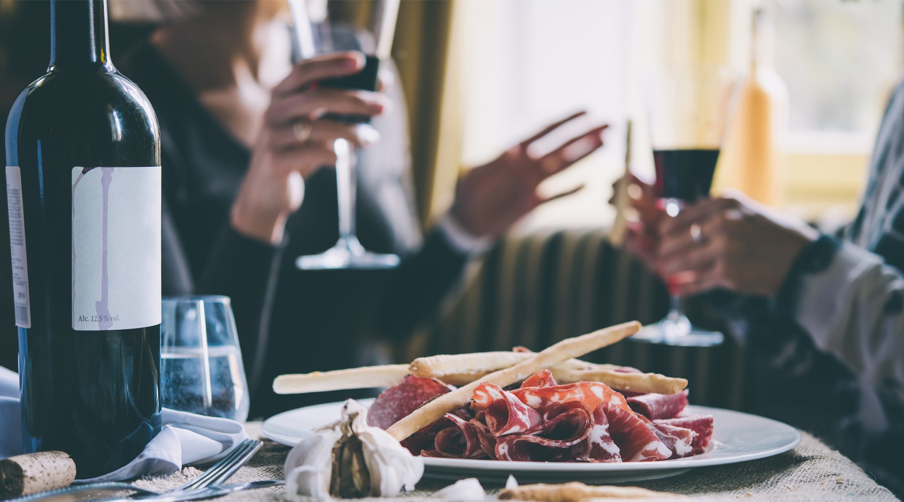 a couple conversing over wine